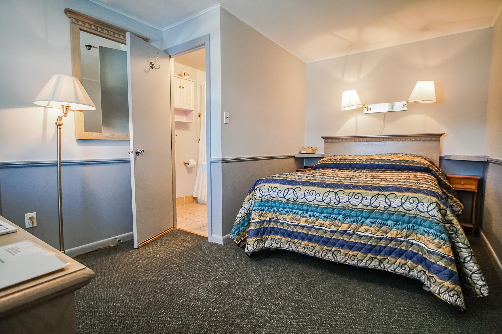 A cozy master bedroom at VRI's Harbor Landing Resort in Massachusetts.
